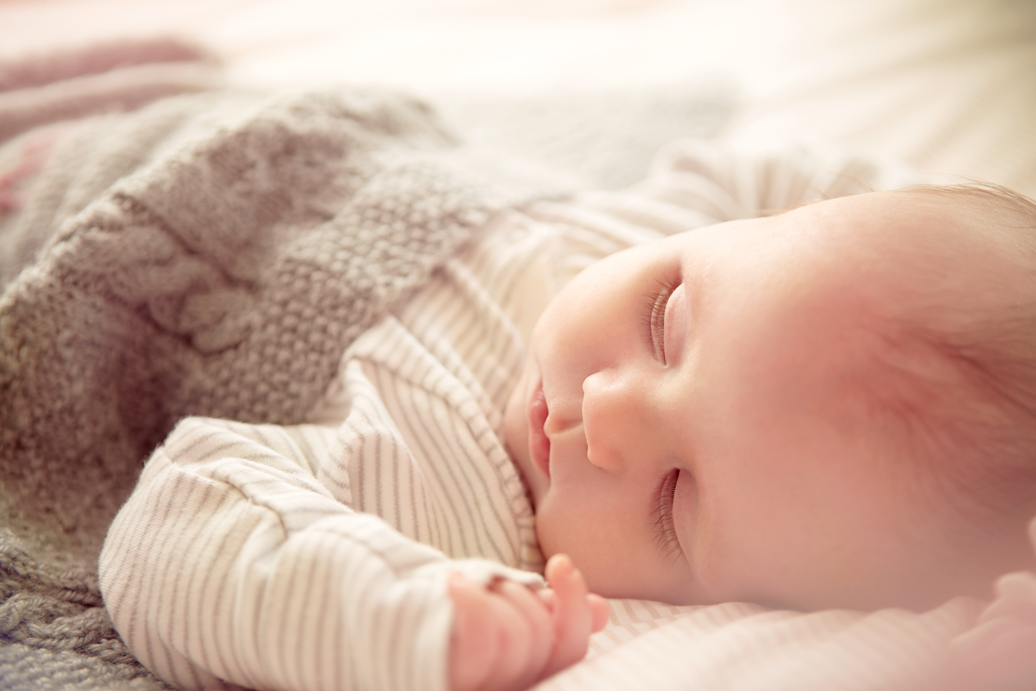 Sleeping baby soft pastel colours Emma Tunbridge
