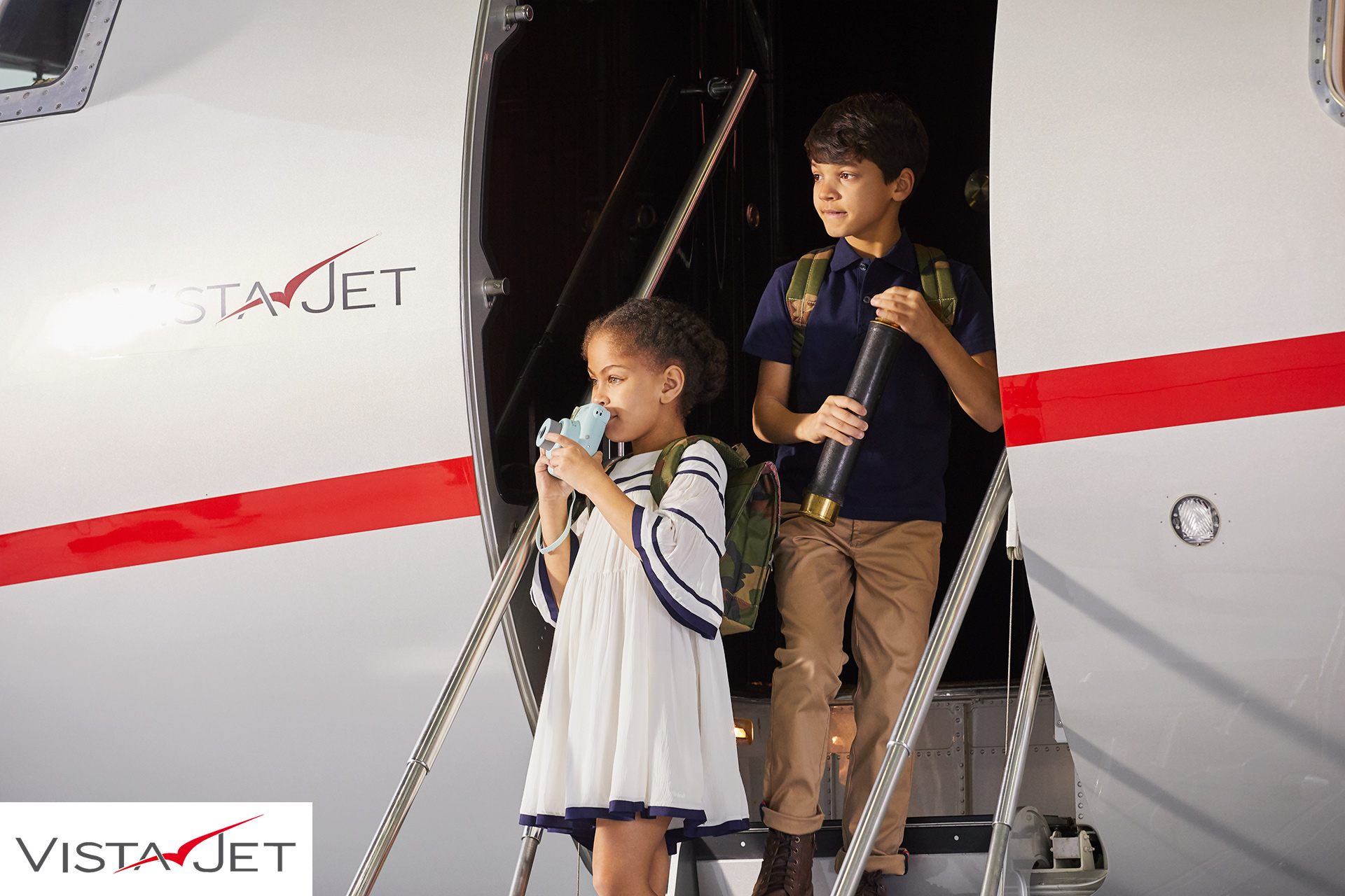 Children disembarking from plane